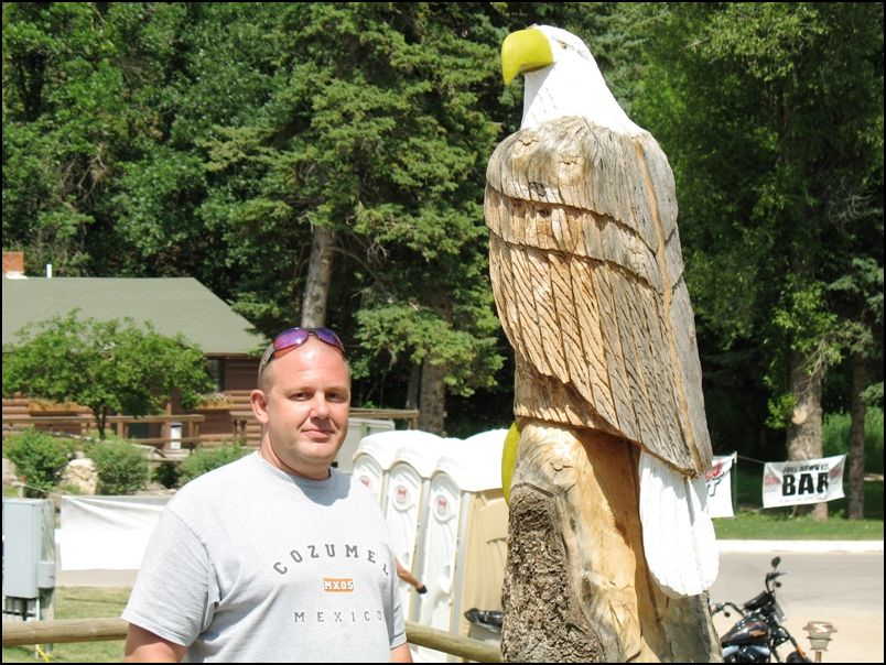 Kevin & eagle carved from tree stump